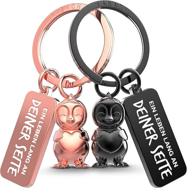 FABACH Schlüsselanhänger für Paare - 2 Pinguine Frosty mit Herz - Glücksbringer Freundin - Partner Liebe Schlüsselanhänger Jahrestag Geschenke Valentinstag, Schwarz & Roségold